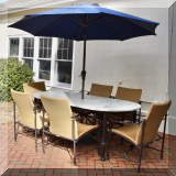 L01. Brown Jordan stone-top patio table with six chairs. 